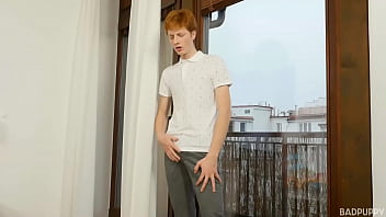 Harry slips out of his underwear exposing his soft ginger bush surrounding a very long, hard, uncut cock.
