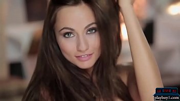 Gorgeous brunette model flirts with the camera and teases us