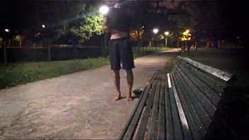 A young guy strips totally in a public park - (almost ?) caught by cyclist