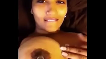 NRI playes with her pierced nipple