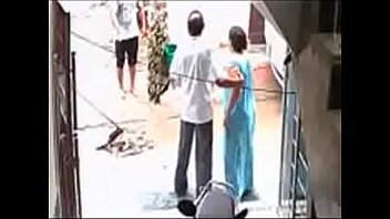 Caught on CCTV  Two neighbours fight over garbage dumping(240p) (1).3GP
