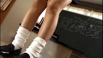 Eri Ueno in sexy uniform sucks cock over boxers until gets cum
