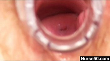 Filthy mature lady toys her hairy pussy with speculum
